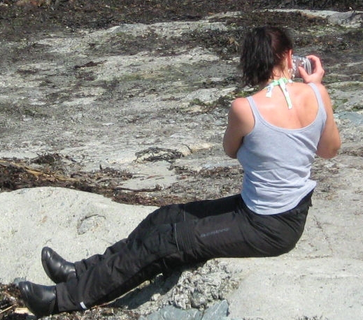 sharon sat on a rocky shore wearing her bering lady fit motorcycle trousers